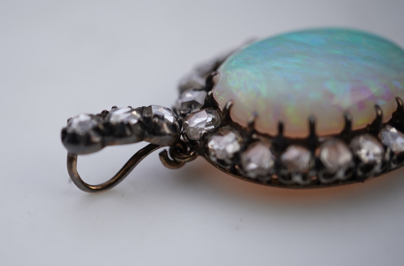 An opal and diamond pendant, early 20th century